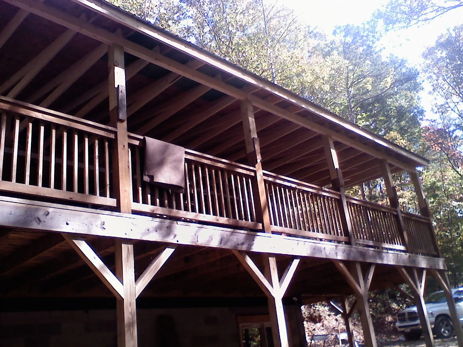 Timber framing under a new elevated porch and deck — Roof Leak Repair in Finger by Roofing Brothers